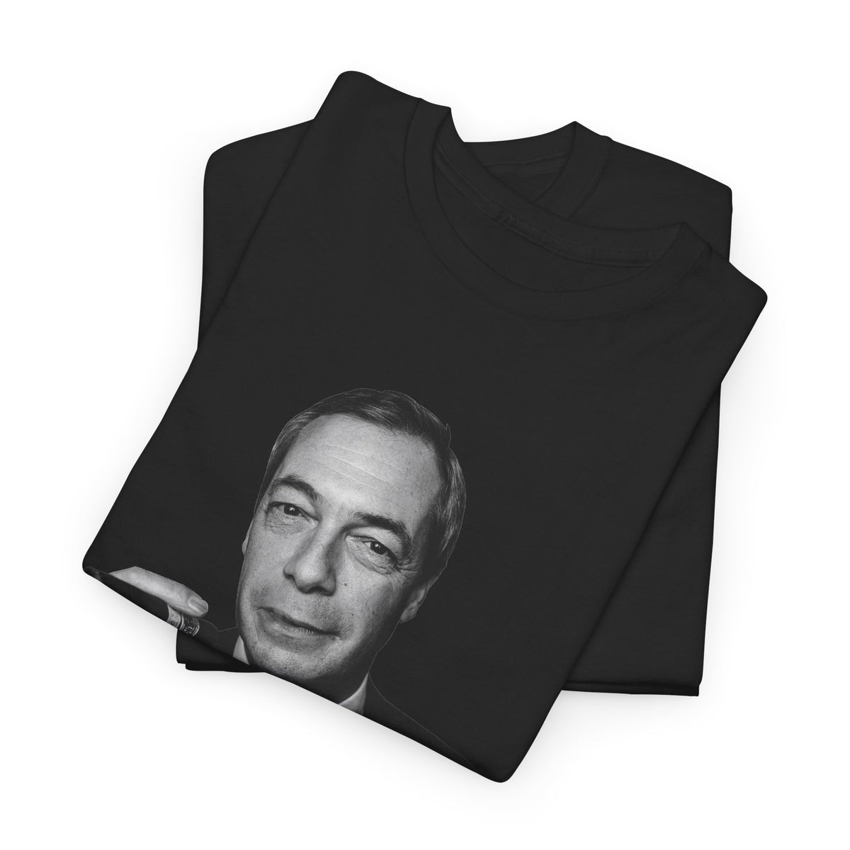 A folded black crewneck t-shirt featuring a black-and-white graphic print of Nigel Farage's face on the front, displayed on a clean white background.