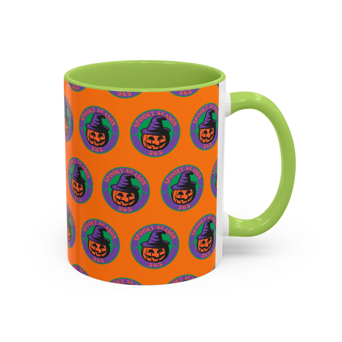 An orange ceramic mug with a repeating Halloween pumpkin pattern, featuring a bright green handle and interior.